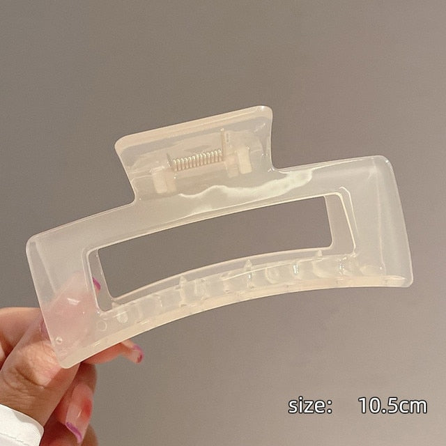 Translucent jumbo acrylic hair claw clip for a modern twist.