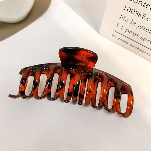 "Jumbo acrylic hair claw clip in vibrant red, perfect for a bold statement."