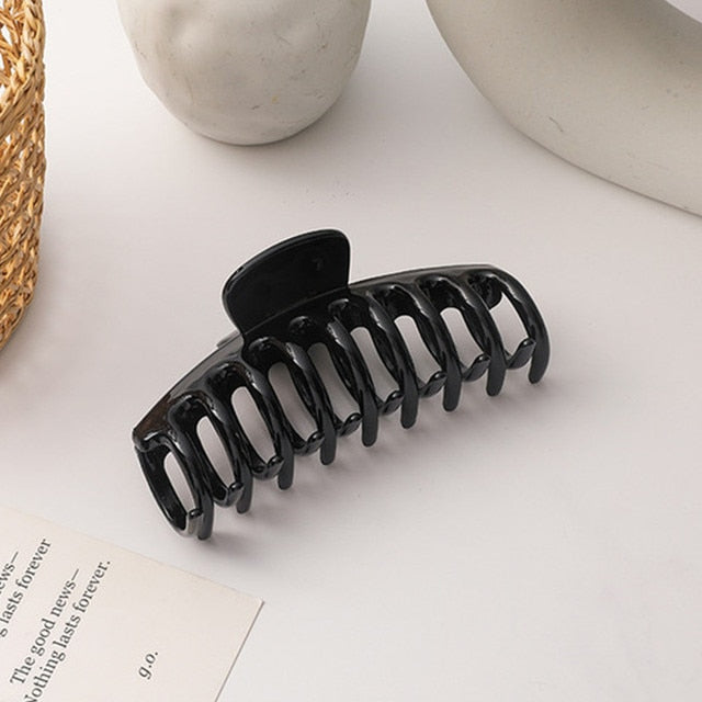 Shiny black jumbo acrylic hair claw clip for a sleek finish